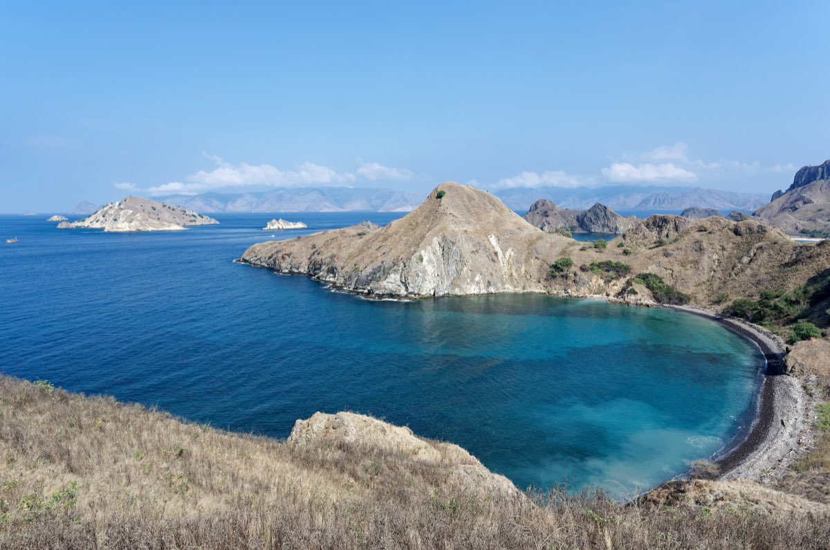 The curved bays and volcanic ridgeline of Padar Island in Komodo National Park.